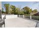 A spacious balcony with white railings overlooks lush trees and greenery at 478 Huger St, Charleston, SC 29403