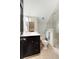 Modern bathroom featuring a vanity, toilet, glass-enclosed shower, and stylish black-and-white tile floor at 478 Huger St, Charleston, SC 29403