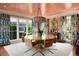 Bright dining room with modern lighting fixture, floral drapes, and ample natural light at 478 Huger St, Charleston, SC 29403