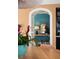 Arched doorway leads to a hallway with a console table and decorative mirror at 478 Huger St, Charleston, SC 29403