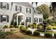 Stately home surrounded by beautifully manicured gardens and lush greenery, highlighted by a decorative fountain and stone facade at 478 Huger St, Charleston, SC 29403