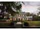 Charming stone home featuring a fountain, lush landscaping, and inviting entryway at 478 Huger St, Charleston, SC 29403