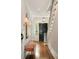 Inviting foyer featuring hardwood floors, a staircase, decorative lighting, and a bench at 478 Huger St, Charleston, SC 29403