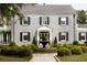 Elegant stone home featuring a well manicured yard and beautiful water feature at 478 Huger St, Charleston, SC 29403
