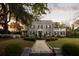 Well-manicured front yard with a stone walkway and fountain, enhancing the home's appeal at 478 Huger St, Charleston, SC 29403