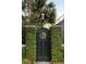 Charming ivy-covered garden gate with an ornate design, adding character and privacy to the property's exterior at 478 Huger St, Charleston, SC 29403