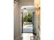 Bright hallway view of the backyard pool through double doors in the Hampton house at 478 Huger St, Charleston, SC 29403