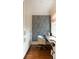 Stylish home office features custom built-ins, striking wallpaper, and natural light from the window at 478 Huger St, Charleston, SC 29403
