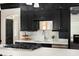 Stylish kitchen featuring dark cabinetry, white countertops, and stainless steel appliances at 478 Huger St, Charleston, SC 29403