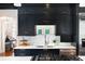 Beautiful kitchen with dark cabinetry, subway tile backsplash, stainless steel sink, and stainless steel appliances at 478 Huger St, Charleston, SC 29403