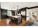 Spacious kitchen with a large central island, stainless steel appliances, and hardwood floors at 478 Huger St, Charleston, SC 29403