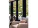 Cozy living area with views of the pool and backyard, featuring large black-framed windows at 478 Huger St, Charleston, SC 29403