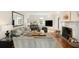 Spacious living room with hardwood floors, fireplace, large mirror, and an abundance of natural light at 478 Huger St, Charleston, SC 29403
