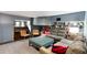 Comfortable living room with gray sofas, built-in bookshelves, and a vintage piano at 478 Huger St, Charleston, SC 29403