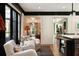 Bright living area with hardwood floors, stylish decor, and black-framed windows that offer lots of light at 478 Huger St, Charleston, SC 29403