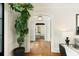 Elegant living room featuring herringbone floors, a large potted plant, and an arched doorway leading to other rooms at 478 Huger St, Charleston, SC 29403