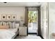 Cozy main bedroom with a door to balcony, stylish furnishings, and natural light at 478 Huger St, Charleston, SC 29403