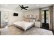 Serene main bedroom with a large bed, stylish decor, and balcony access at 478 Huger St, Charleston, SC 29403