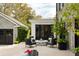 Stone patio featuring a fire pit, comfortable seating, and manicured landscaping, ideal for relaxation at 478 Huger St, Charleston, SC 29403