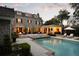 Relaxing pool and patio area with outdoor kitchen and lounge chairs in a well maintained backyard at 478 Huger St, Charleston, SC 29403