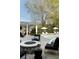 Pool and outdoor entertainment area with a stone fireplace and outdoor dining under the covered porch at 478 Huger St, Charleston, SC 29403