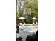 Relaxing pool area with lounge chairs, umbrellas, and well-manicured greenery at 478 Huger St, Charleston, SC 29403