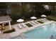 Luxurious pool with tanning ledges and a fully equipped outdoor kitchen and lounge area at 478 Huger St, Charleston, SC 29403