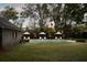 Large backyard with in-ground pool, sun loungers, and lush landscaping, perfect for relaxation at 478 Huger St, Charleston, SC 29403