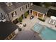 Aerial view of a stone home with a pool, spa, fire pit, and outdoor kitchen at 478 Huger St, Charleston, SC 29403