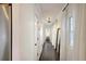 Bright hallway with hardwood floors, sheer curtains, and a full-length mirror at 5 Kracke St # A, Charleston, SC 29403