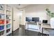 Functional home office with built-in bookshelves, a modern desk setup, and ample natural light at 5 Kracke St # A, Charleston, SC 29403