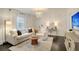 Bright living room with hardwood floors and lots of natural light at 5 Kracke St # A, Charleston, SC 29403
