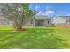 Large backyard with well kept lawn and mature shade tree at 5033 Thornton Dr, Summerville, SC 29485