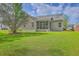 Spacious backyard with a well-maintained lawn, a screened porch, and privacy at 5033 Thornton Dr, Summerville, SC 29485