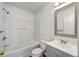 Clean bathroom with white tub, gray vanity, and modern fixtures at 5033 Thornton Dr, Summerville, SC 29485