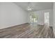 Bright living room featuring luxury vinyl plank flooring, white walls, and a sliding glass door leading to the patio at 5033 Thornton Dr, Summerville, SC 29485