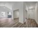 Bright living room with light gray walls, vaulted ceiling, and luxury vinyl plank flooring at 5033 Thornton Dr, Summerville, SC 29485