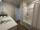 Well-lit bathroom with a large vanity, white cabinets, and combined tub/shower at 5108 Double Eagle Lp, Summerville, SC 29485