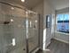 Contemporary bathroom with a glass-enclosed shower and a view of the neighborhood at 5108 Double Eagle Lp, Summerville, SC 29485