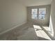 Sunlit empty bedroom with two large windows offering great natural light at 5108 Double Eagle Lp, Summerville, SC 29485
