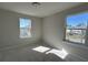 Sunlit empty bedroom with two large windows offering great natural light at 5108 Double Eagle Lp, Summerville, SC 29485