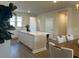 A kitchen featuring an island, white cabinets, and a view into the dining room at 5108 Double Eagle Lp, Summerville, SC 29485