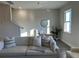 A bright, staged living room featuring a plush sofa and neutral decor at 5108 Double Eagle Lp, Summerville, SC 29485