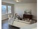 Cozy living room with abundant natural light, stylish furniture, and hardwood flooring at 5108 Double Eagle Lp, Summerville, SC 29485