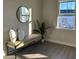 Bright interior room showcasing a leather bench, modern decor, and a large window at 5108 Double Eagle Lp, Summerville, SC 29485