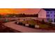 Charming two-story townhomes in a community near green spaces, captured under a vibrant and colorful sky at 5108 Double Eagle Lp, Summerville, SC 29485