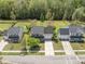An aerial view shows a well-kept home with a large driveway and lawns in a peaceful residential setting at 529 Beverly Dr, Summerville, SC 29485