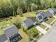 This aerial view captures a well-maintained home, driveway, and manicured lawns in a peaceful, residential neighborhood at 529 Beverly Dr, Summerville, SC 29485