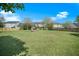 Large backyard with a firepit surrounded by lounge chairs at 529 Beverly Dr, Summerville, SC 29485
