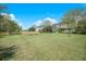 Large backyard with a firepit surrounded by lounge chairs at 529 Beverly Dr, Summerville, SC 29485
